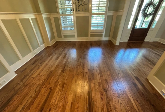 Wood floor extending through a bright living room